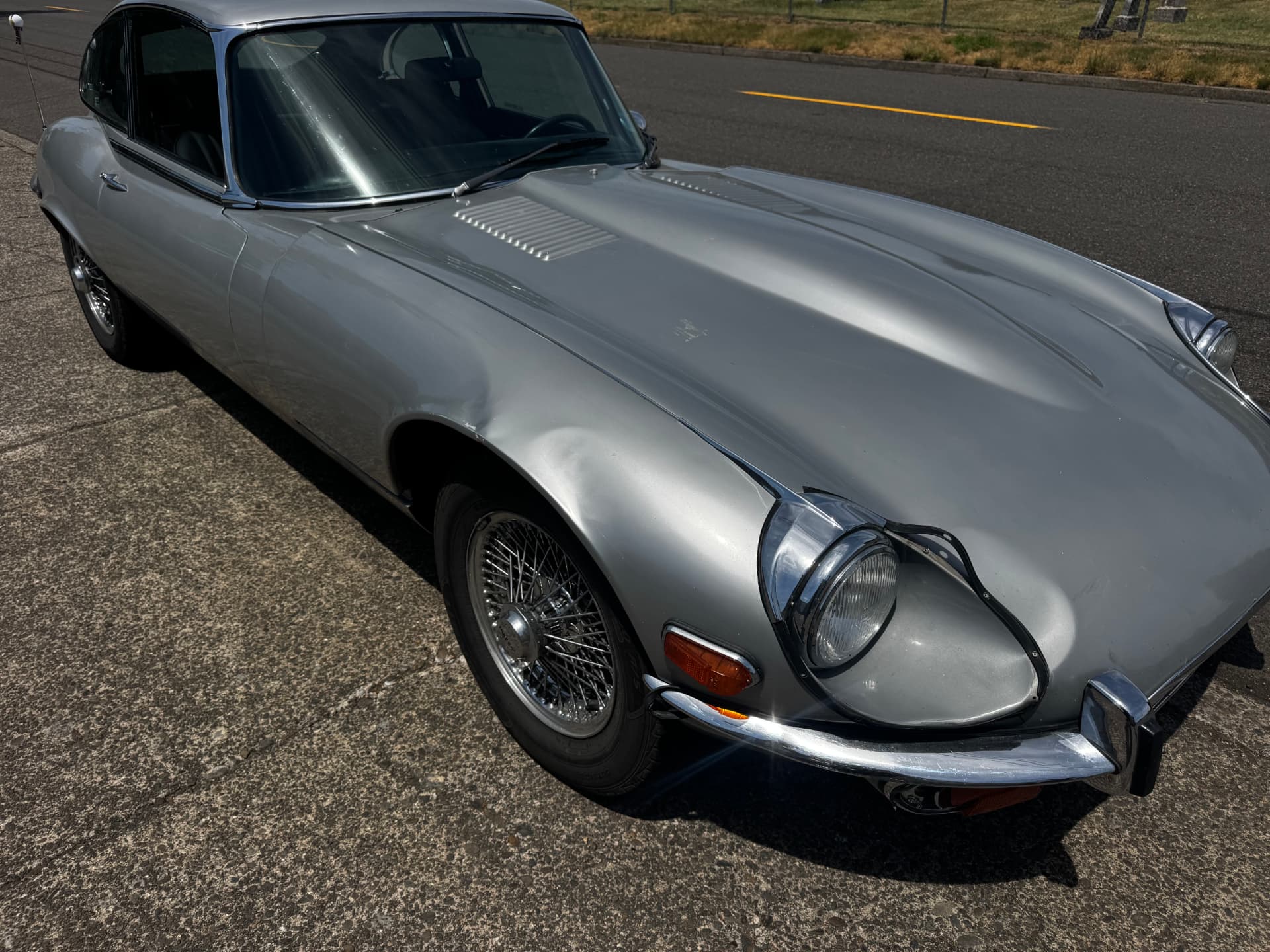 Silver Jaguar E-Type after bodywork and refinishing